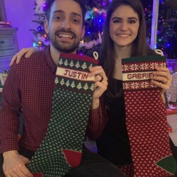 two people with Christmas Stockings