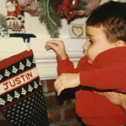 baby with christmas stocking